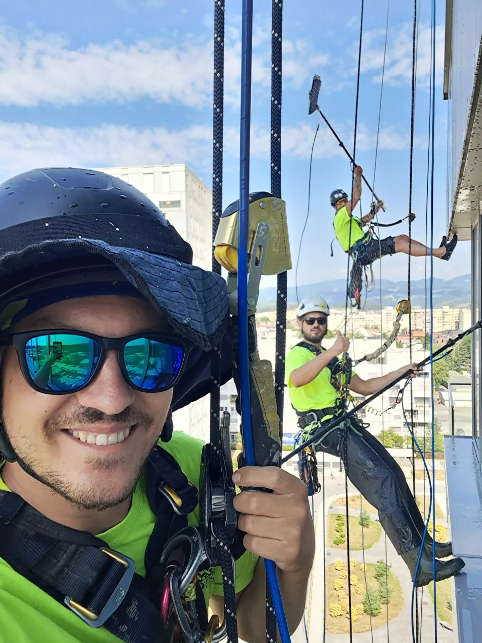 IRATA founder Aljaz Bercic hanging from building in a photo